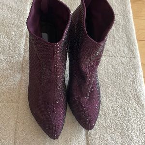Maroon glitter high heel booties.